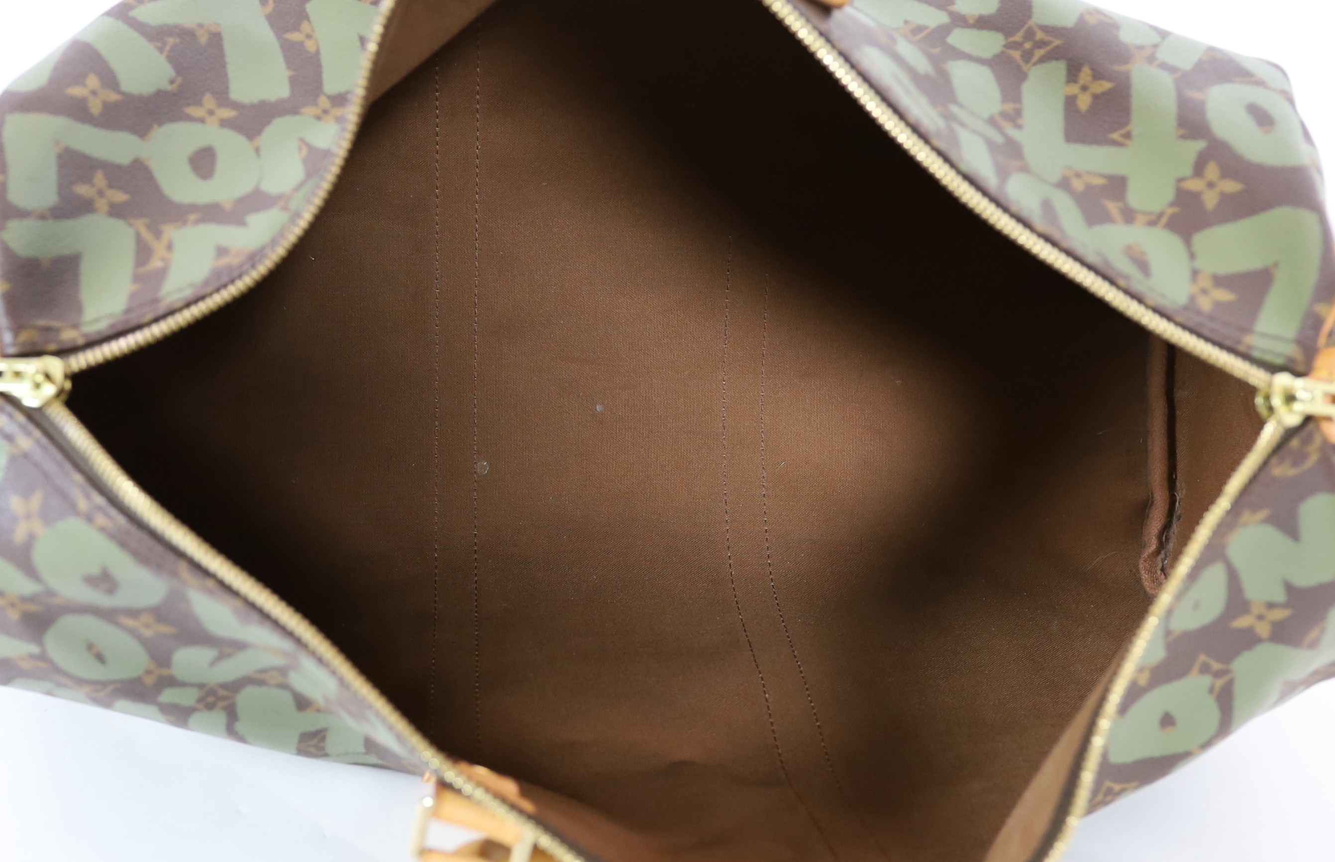A vintage 2001 Louis Vuitton Stephen Sprouse Khaki Green Monogram Graffiti Keepall 50
